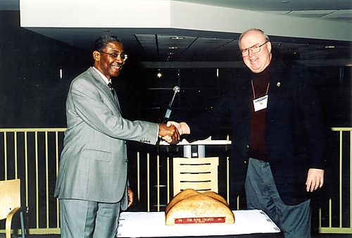 UPB President Dr. Livingston Alexander and UPG President Dr. Frank A. Cassell with the Rose Trophy